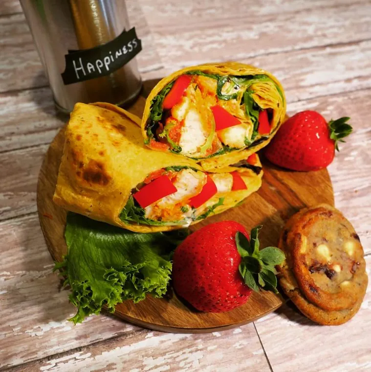 Post Exchange Catering chicken wrap with strawberries and a cookie