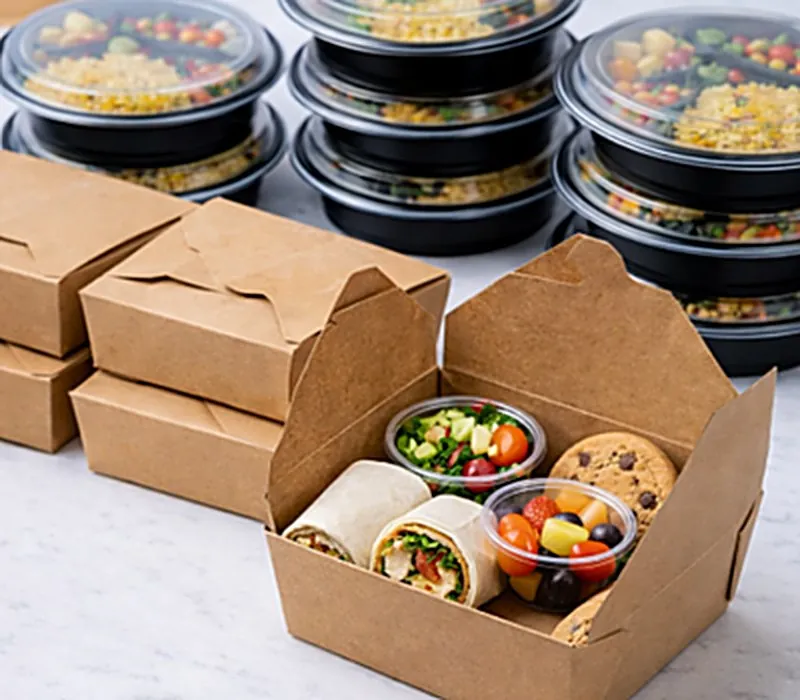 Individually boxed catered lunches, each labeled and packaged for a corporate meeting