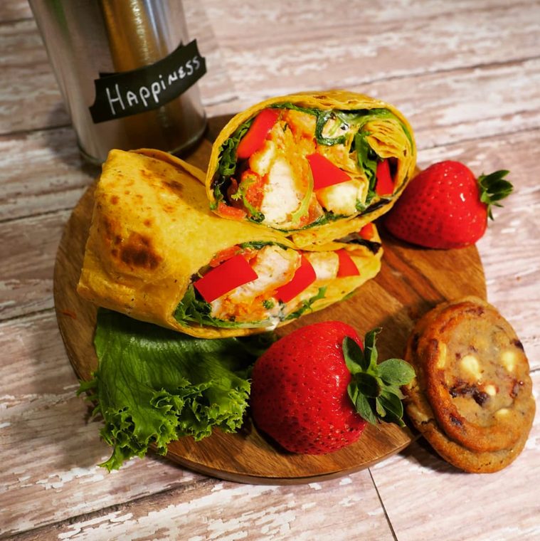 Post Exchange Catering chicken wrap with strawberries and a cookie